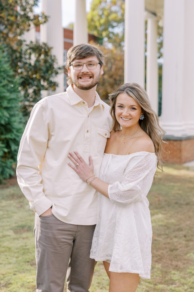 a couple having an engagement session in town park, madison, ga 