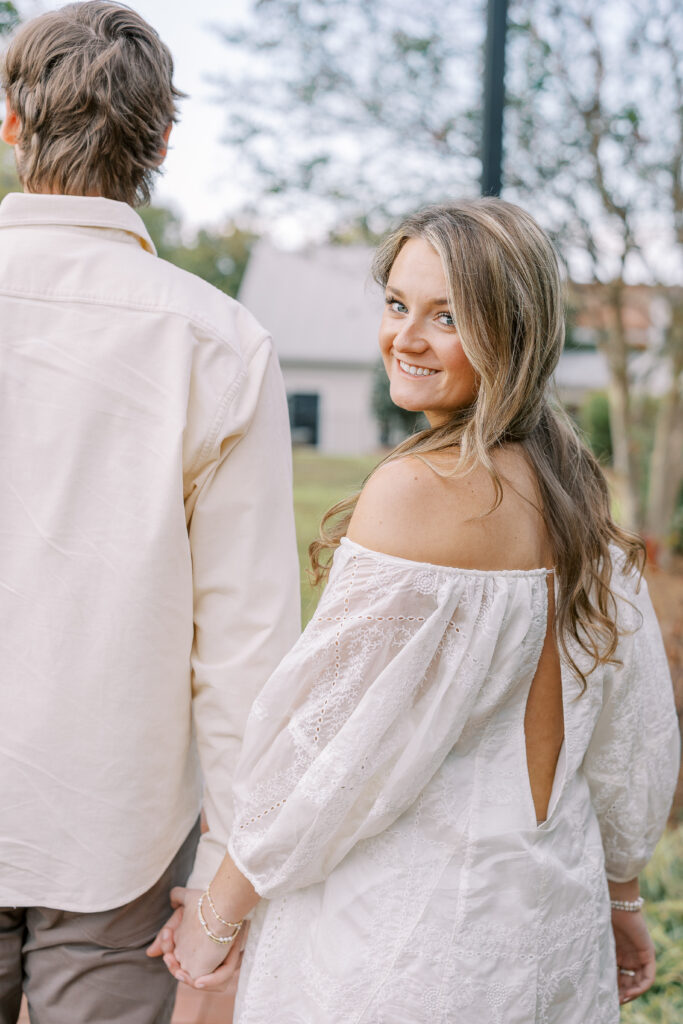 a couple having an engagement session in town park, madison, ga 