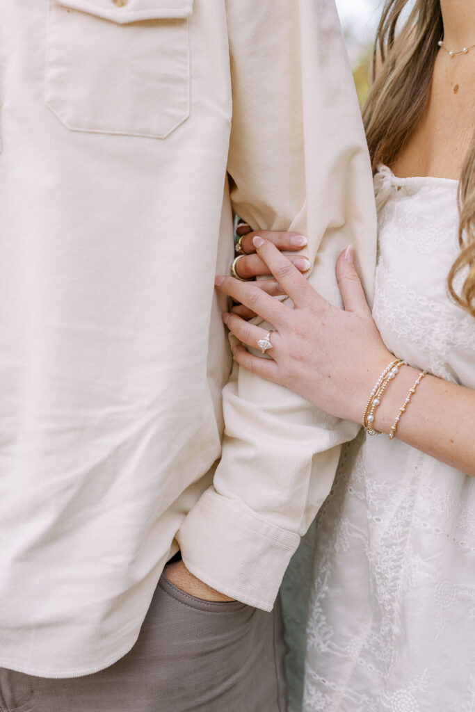 a couple having an engagement session in town park, madison, ga 