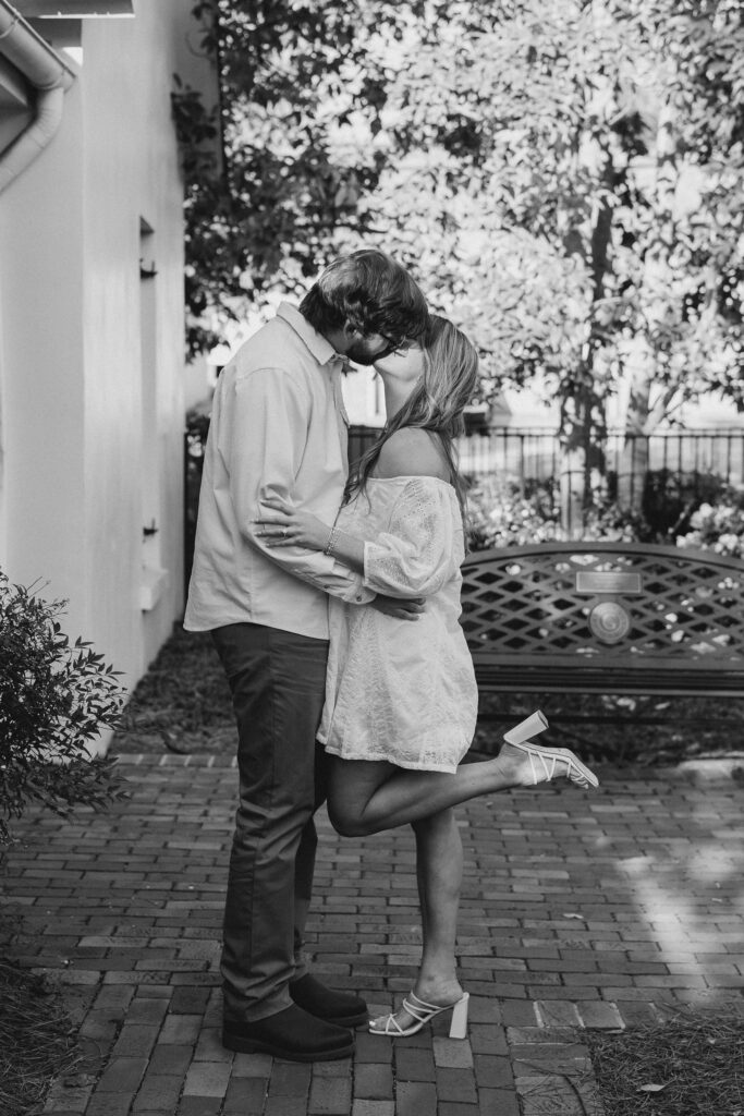 a couple having an engagement session in town park, madison, ga 