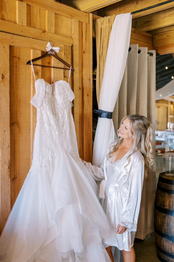 bride looking at her wedding dress