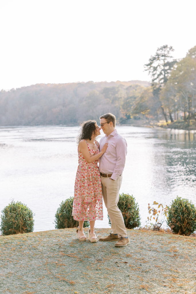 a couple having their engagement session on the banks of the chattahoochee river