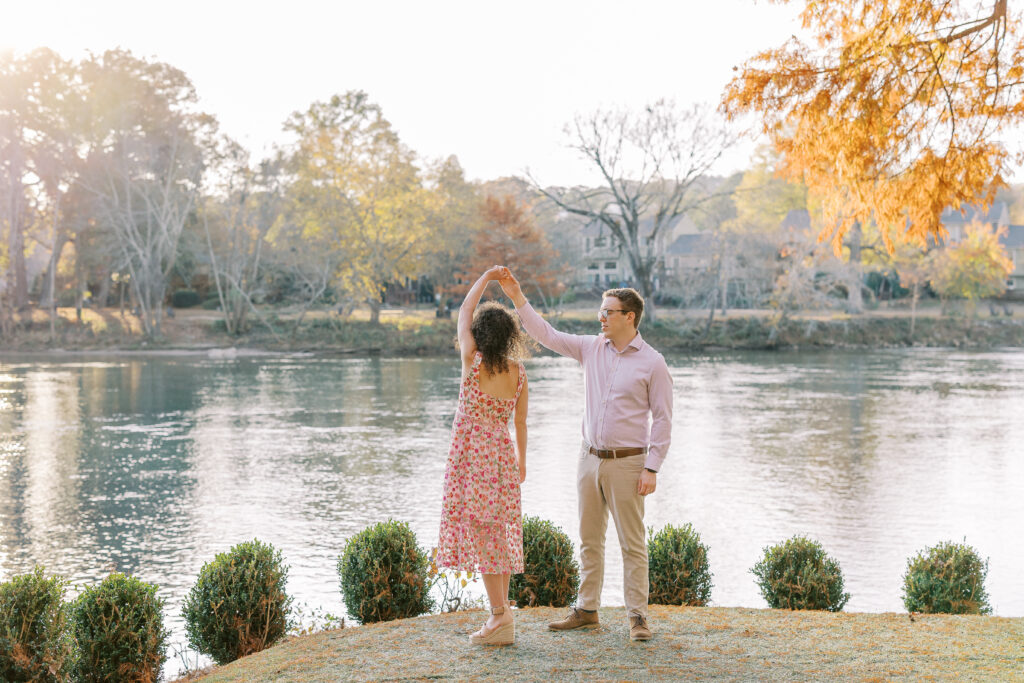 a couple having their engagement session on the banks of the chattahoochee river