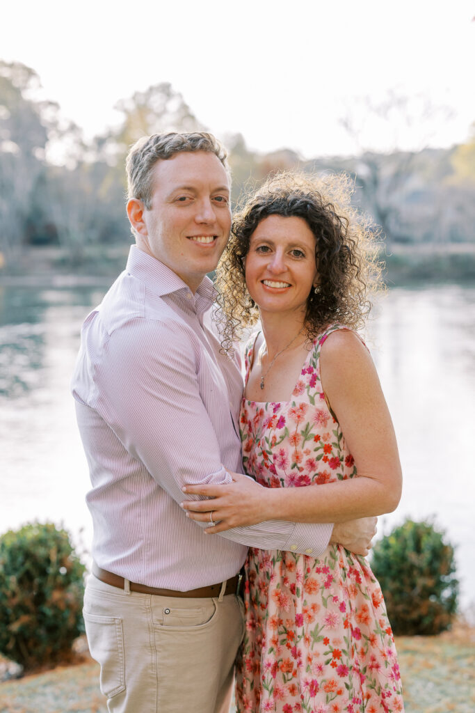 a couple having their engagement session on the banks of the chattahoochee river