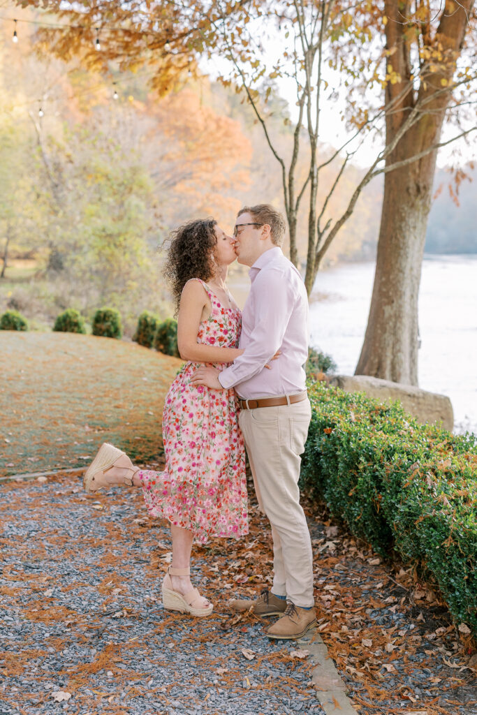 a couple having their engagement session on the banks of the chattahoochee river
