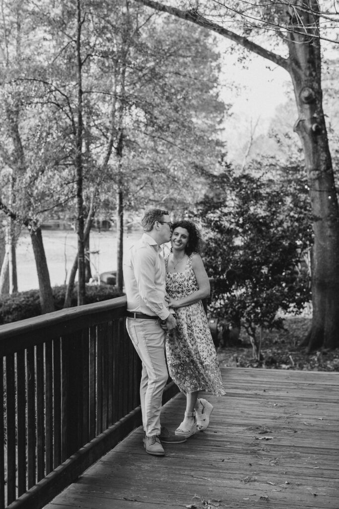 a couple having their engagement session on the banks of the chattahoochee river