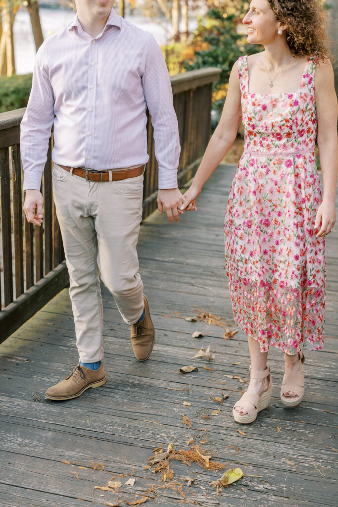 a couple having their engagement session on the banks of the chattahoochee river