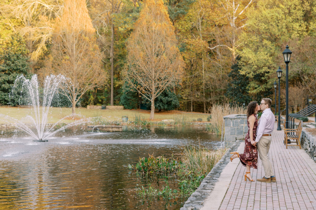 a couple having their engagement session on the banks of the chattahoochee river