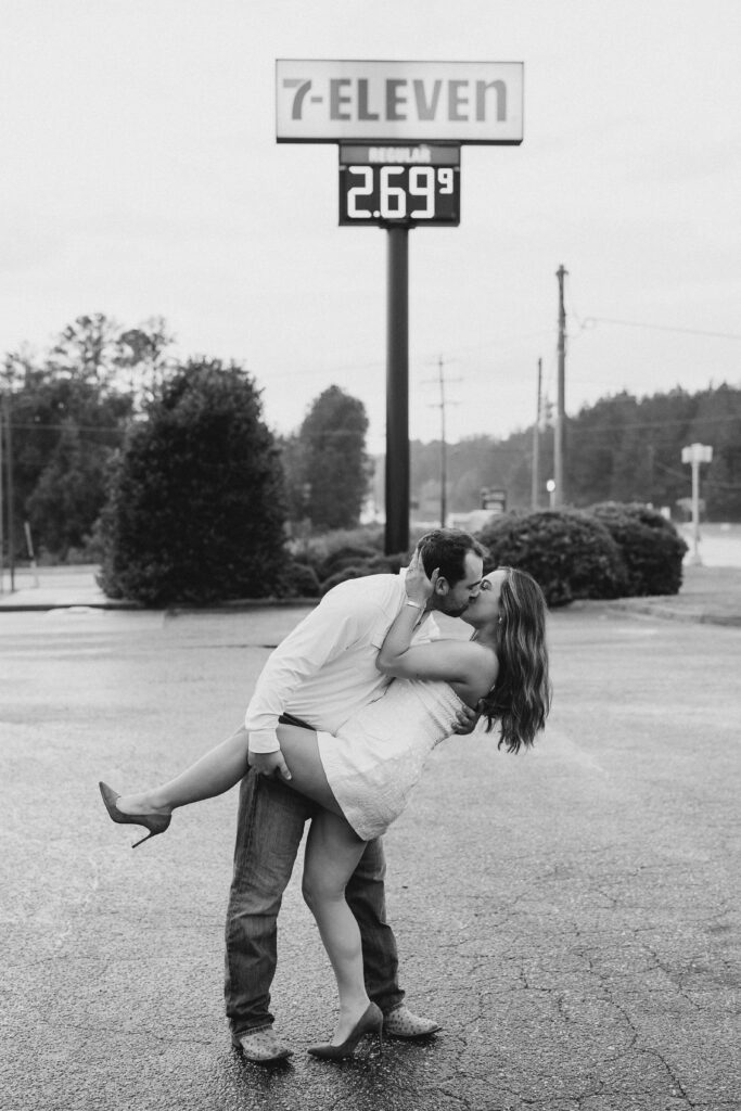 a couple taking a save the date photography session at the 7 Eleven gas station