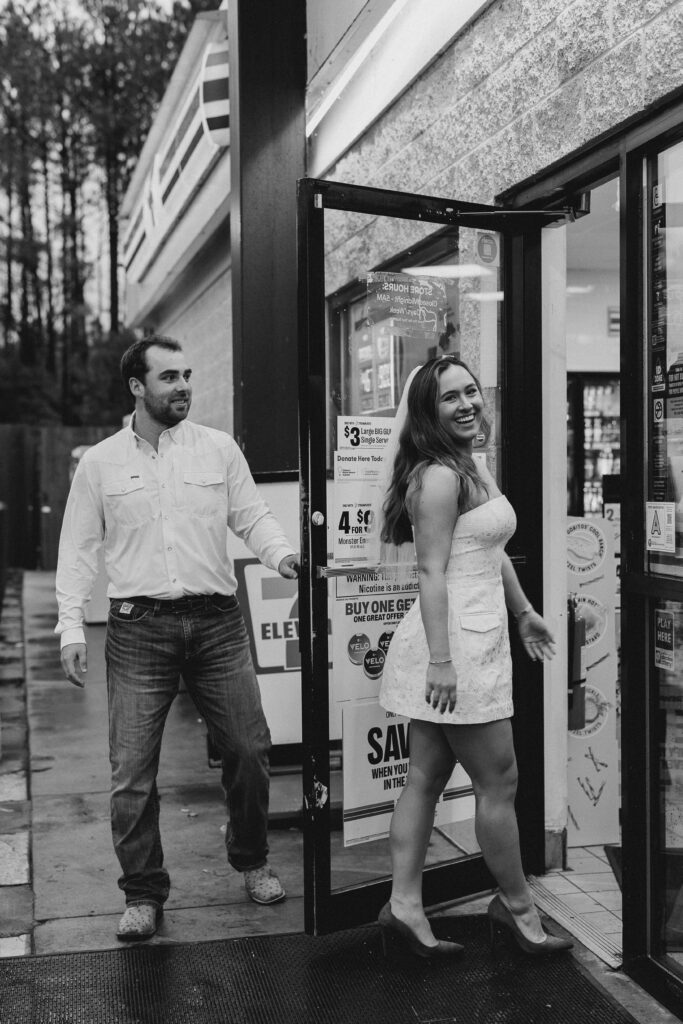 a couple taking a save the date photography session at the 7 Eleven gas station