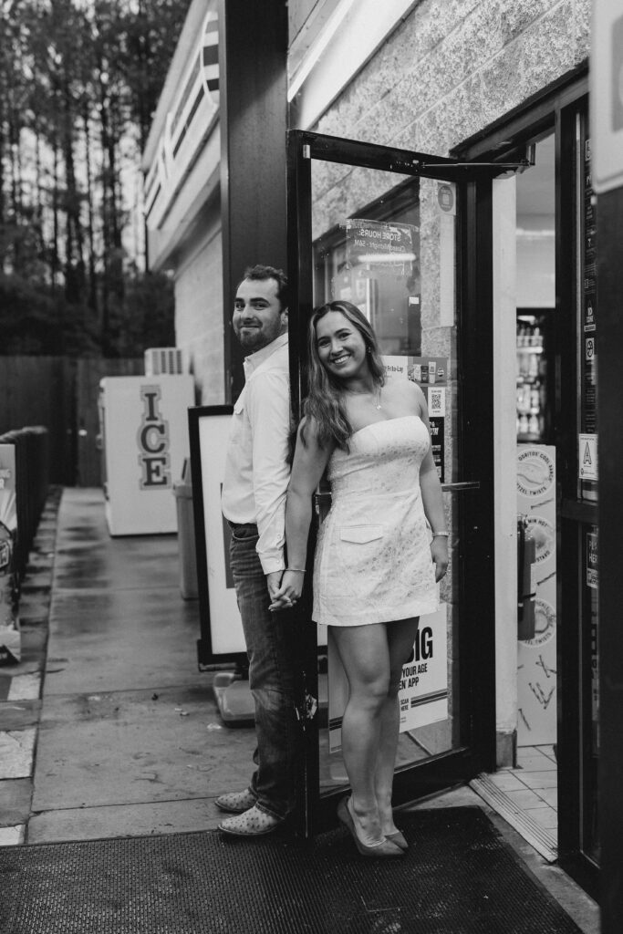 a couple taking a save the date photography session at the 7 Eleven gas station