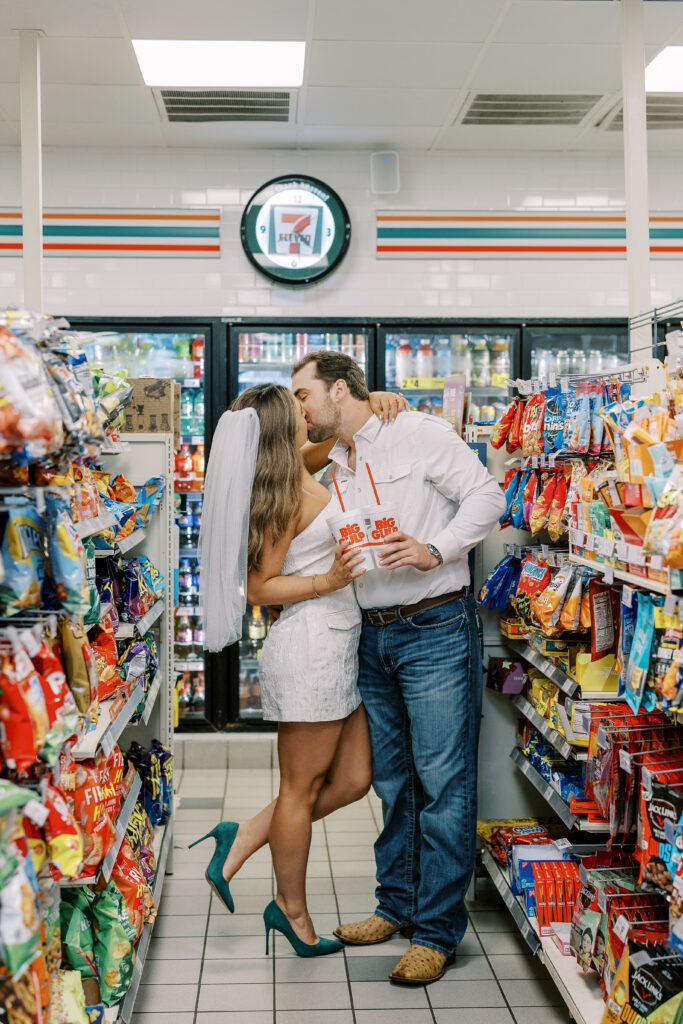 a couple taking a save the date photography session at the 7 Eleven gas station