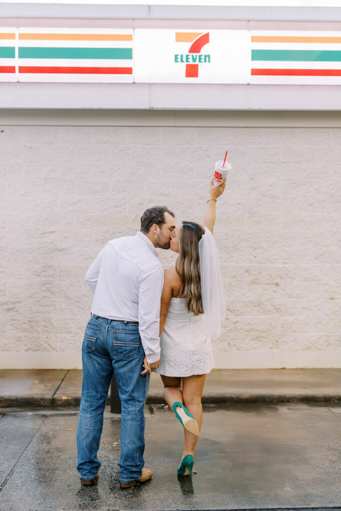 a couple taking a save the date photography session at the 7 Eleven gas station