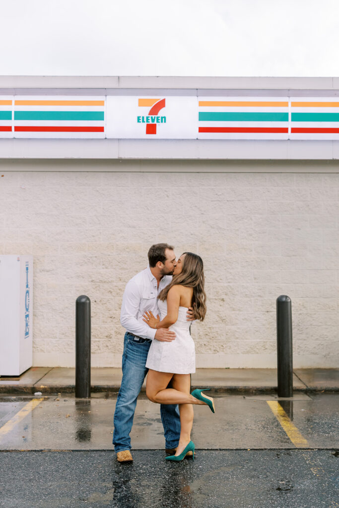 a couple taking a save the date photography session at the 7 Eleven gas station