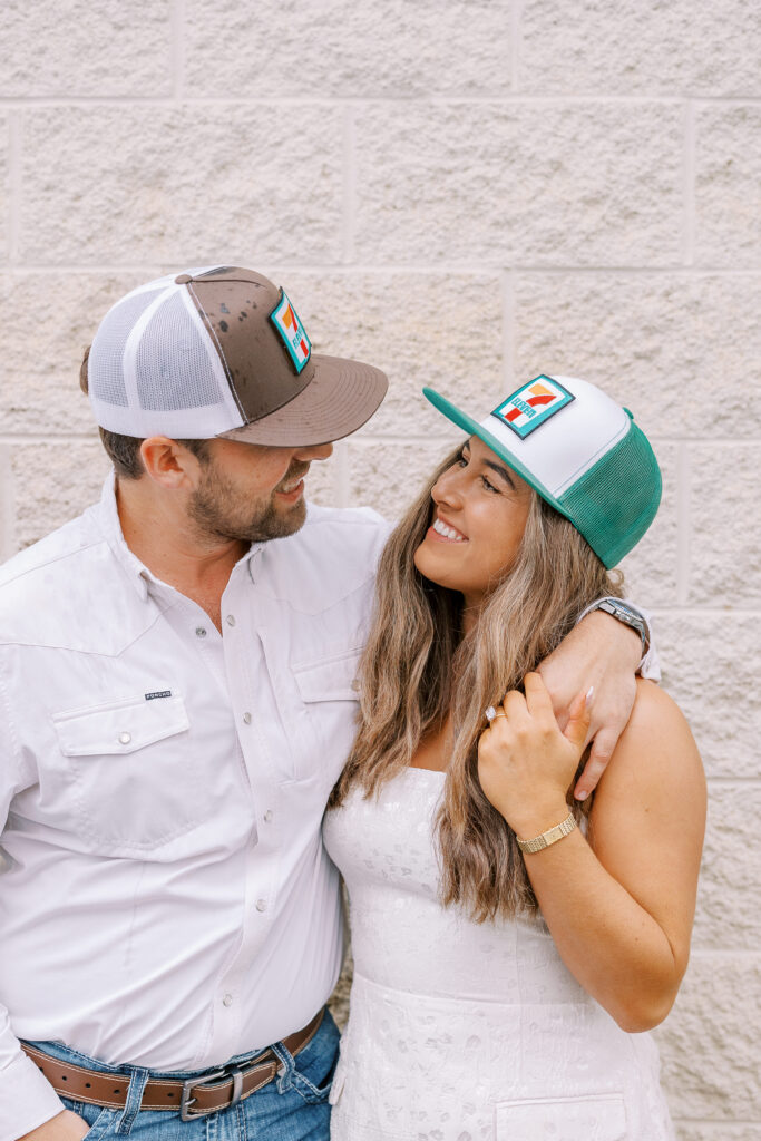 a couple taking a save the date photography session at the 7 Eleven gas station