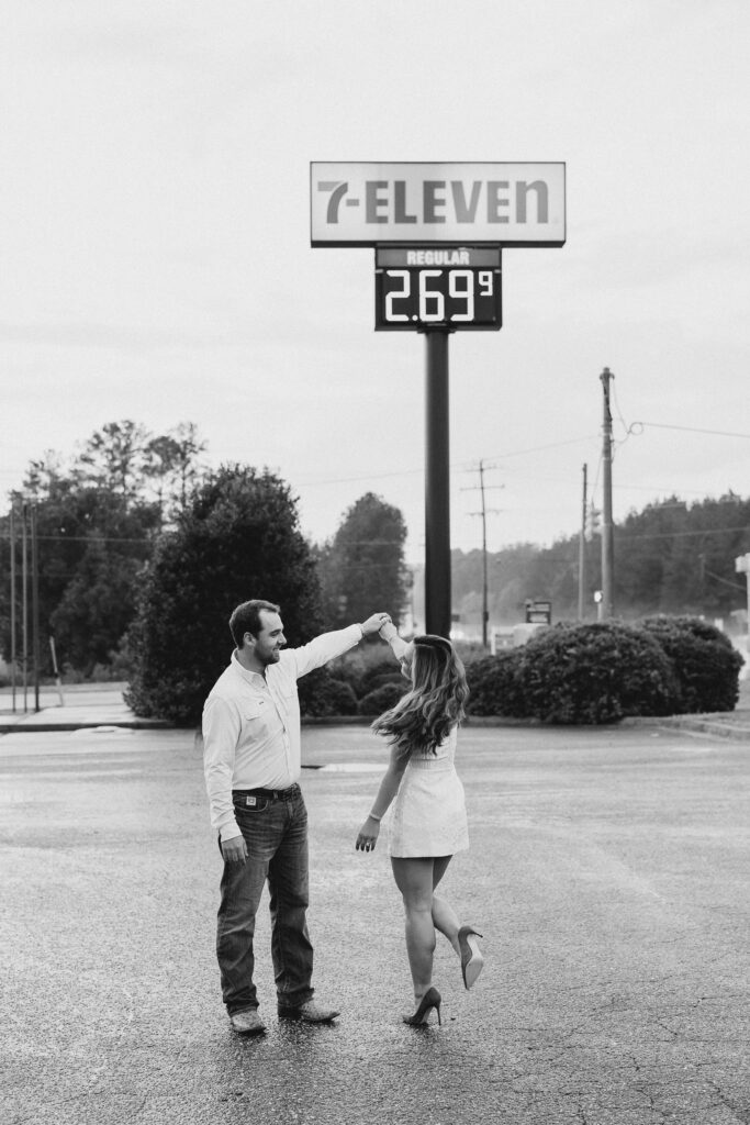 a couple taking a save the date photography session at the 7 Eleven gas station