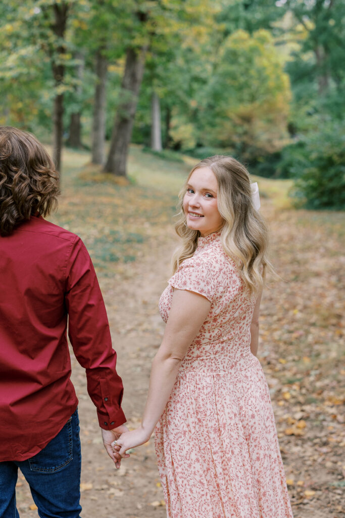 a couple taking an engagement photography session at winn park in atlanta, georgia