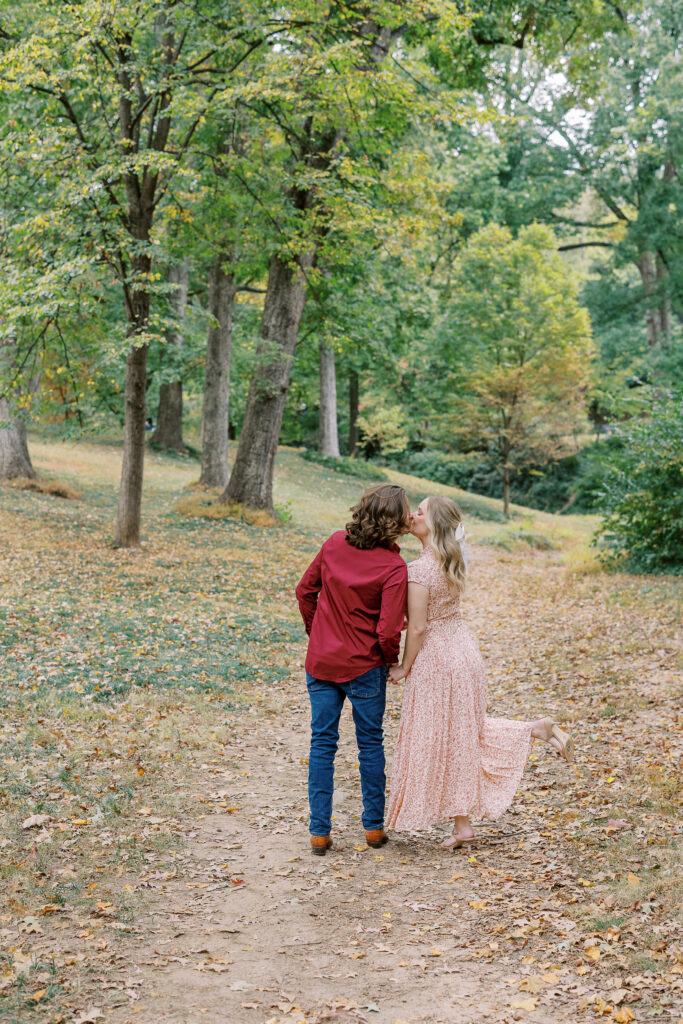 a couple taking an engagement photography session at winn park in atlanta, georgia
