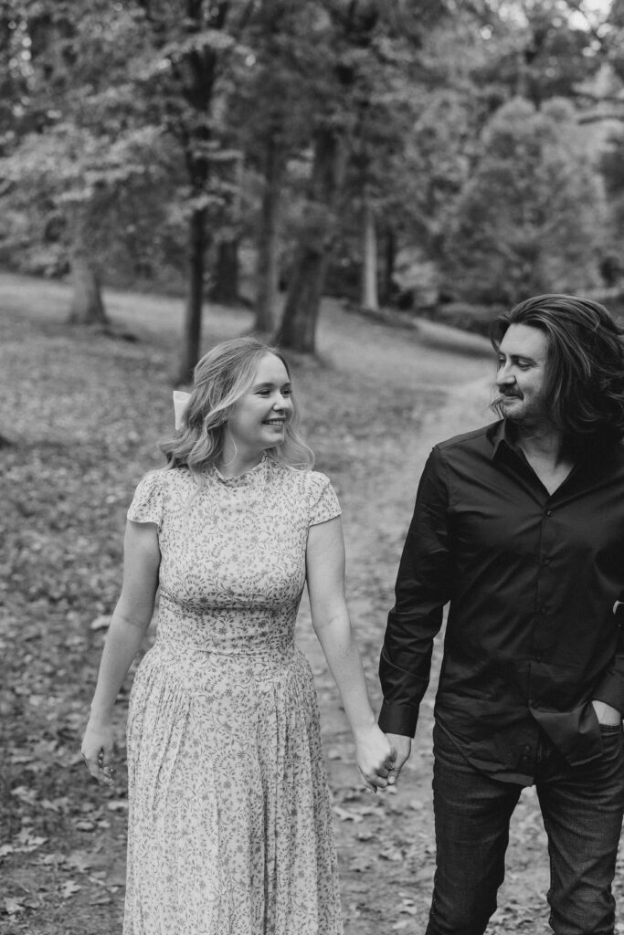 a couple taking an engagement photography session at winn park in atlanta, georgia