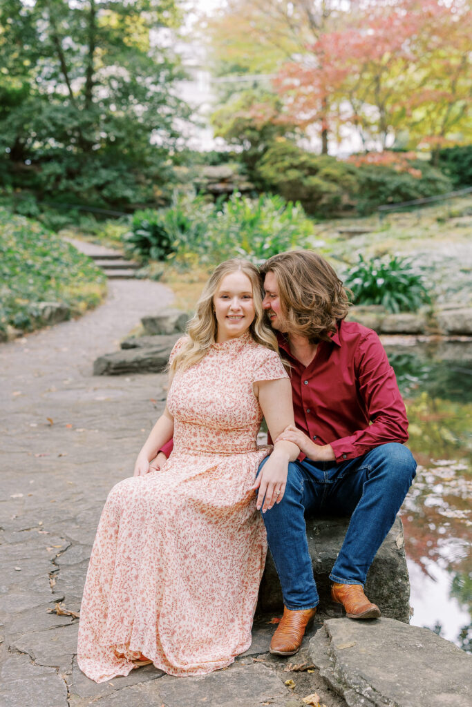 a couple taking an engagement photography session at winn park in atlanta, georgia