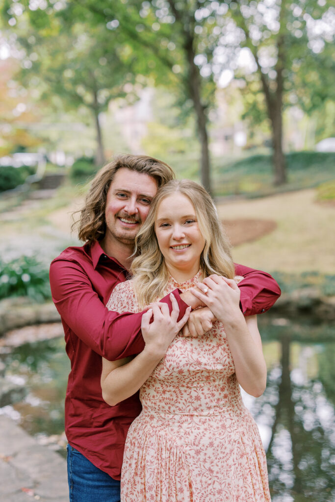a couple taking an engagement photography session at winn park in atlanta, georgia