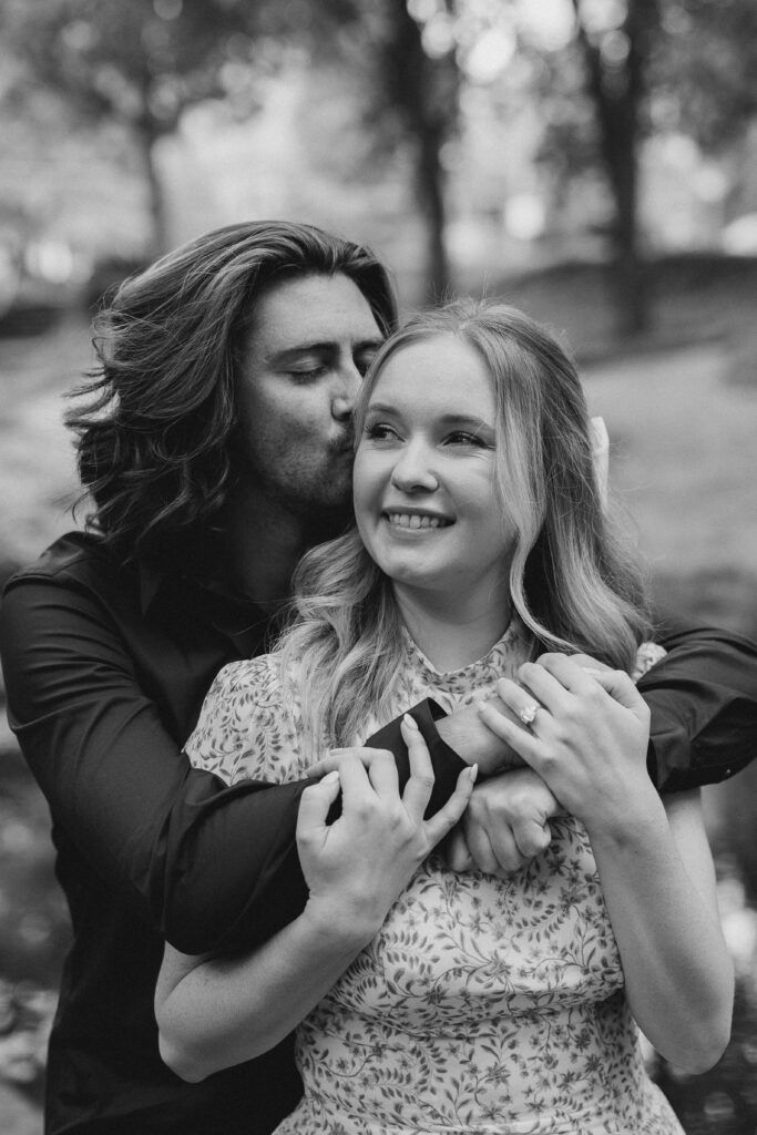 a couple taking an engagement photography session at winn park in atlanta, georgia