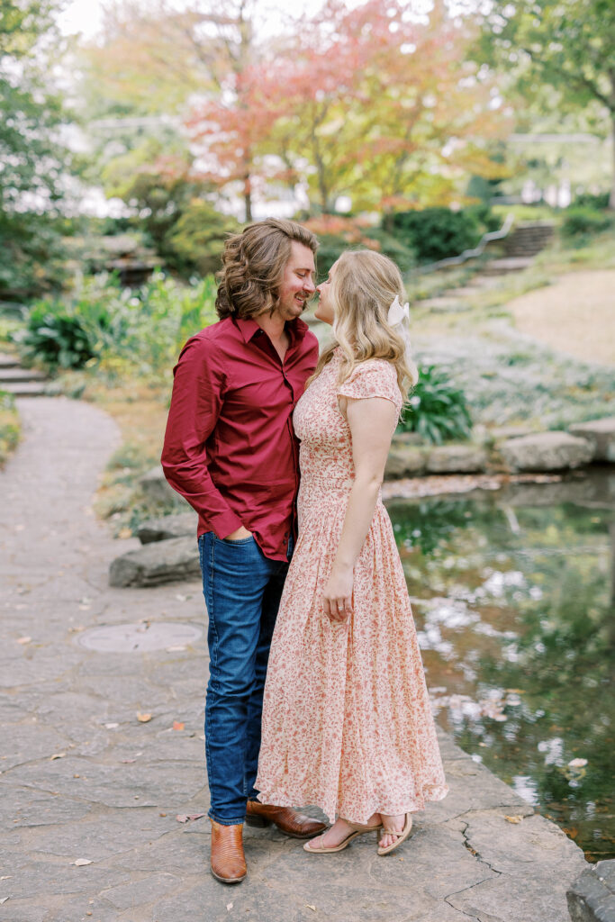 a couple taking an engagement photography session at winn park in atlanta, georgia
