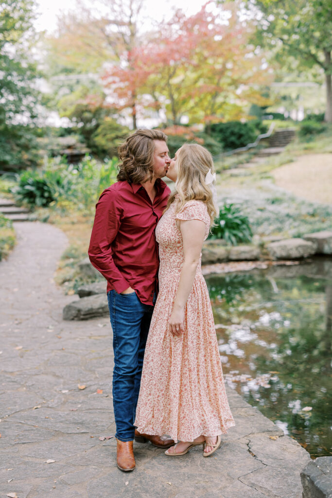 a couple taking an engagement photography session at winn park in atlanta, georgia