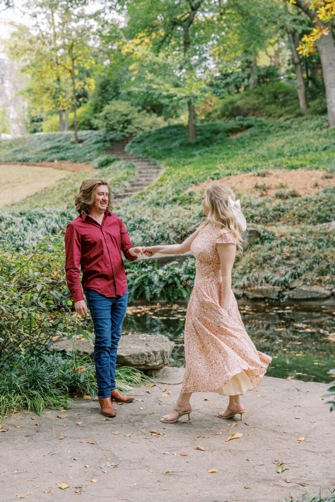a couple taking an engagement photography session at winn park in atlanta, georgia