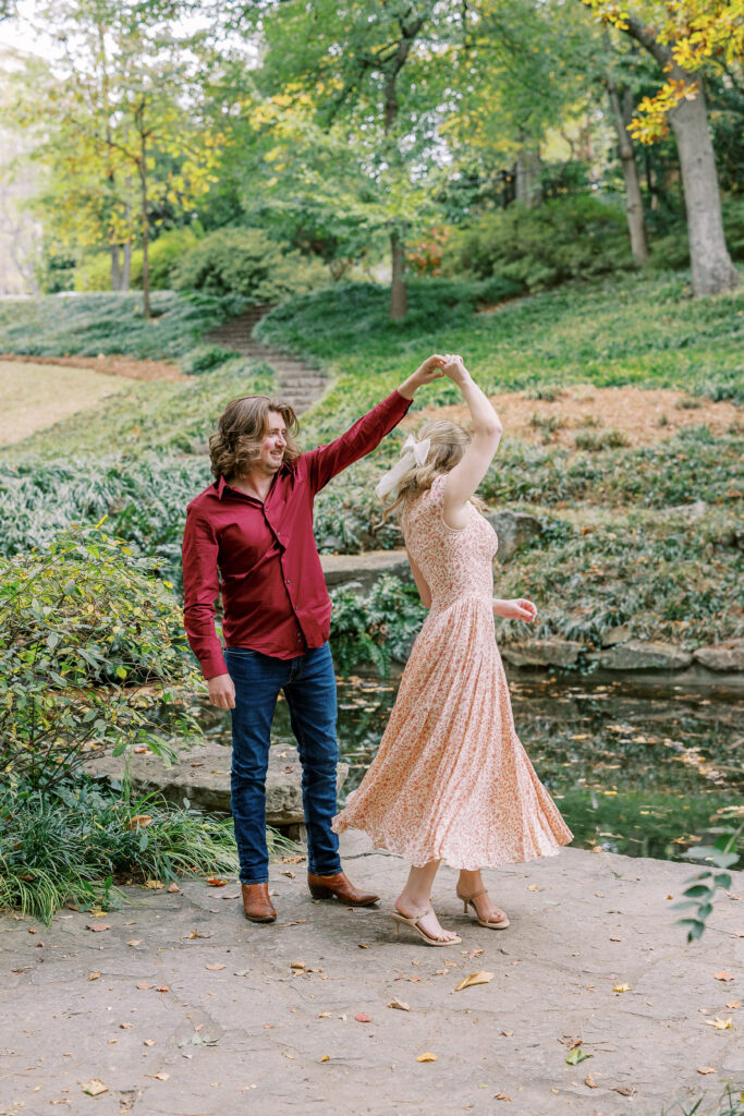 a couple taking an engagement photography session at winn park in atlanta, georgia