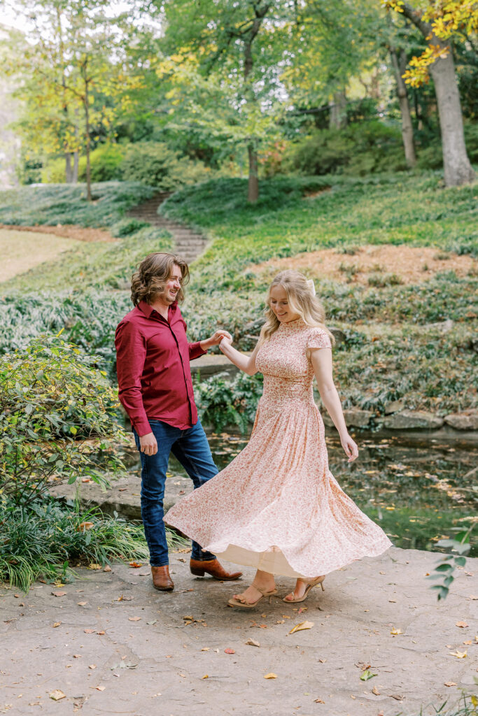 a couple taking an engagement photography session at winn park in atlanta, georgia