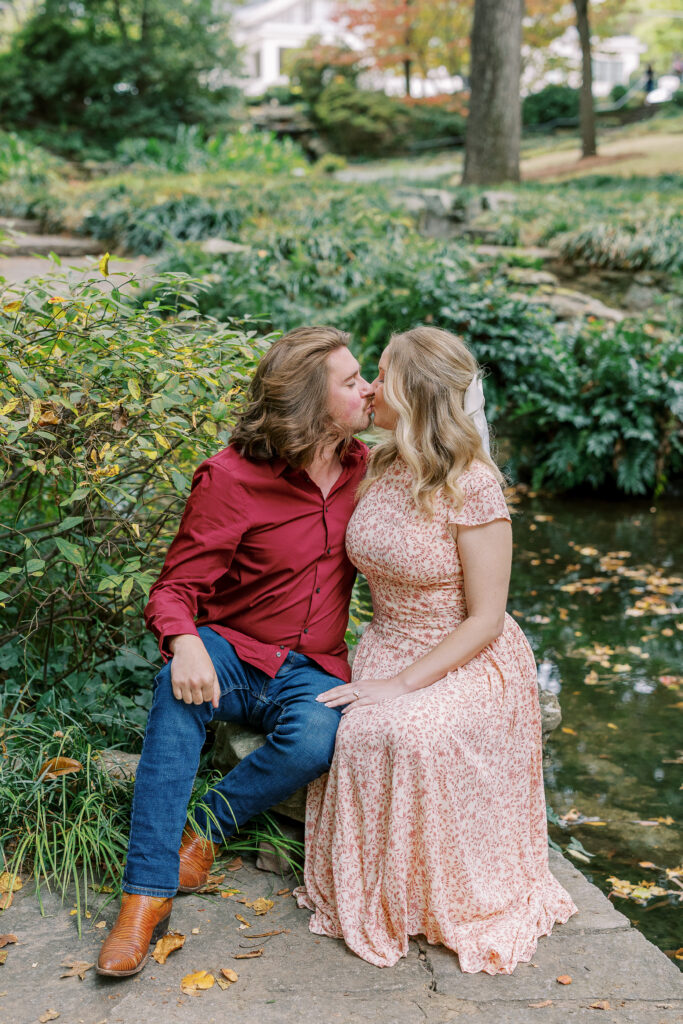 a couple taking an engagement photography session at winn park in atlanta, georgia