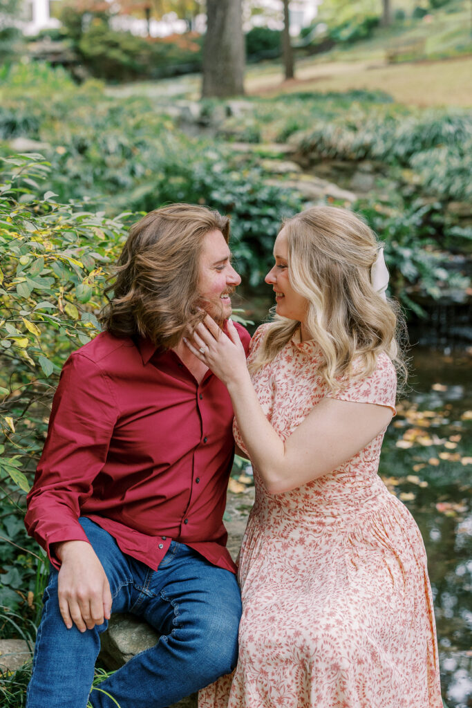 a couple taking an engagement photography session at winn park in atlanta, georgia