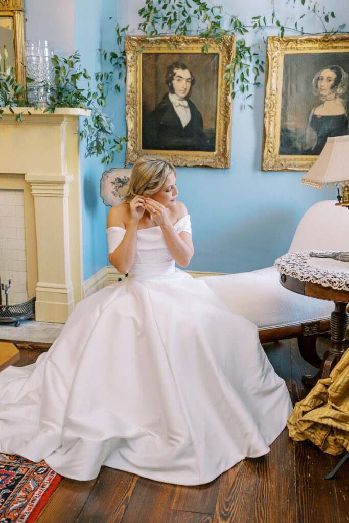 bride putting in earring
