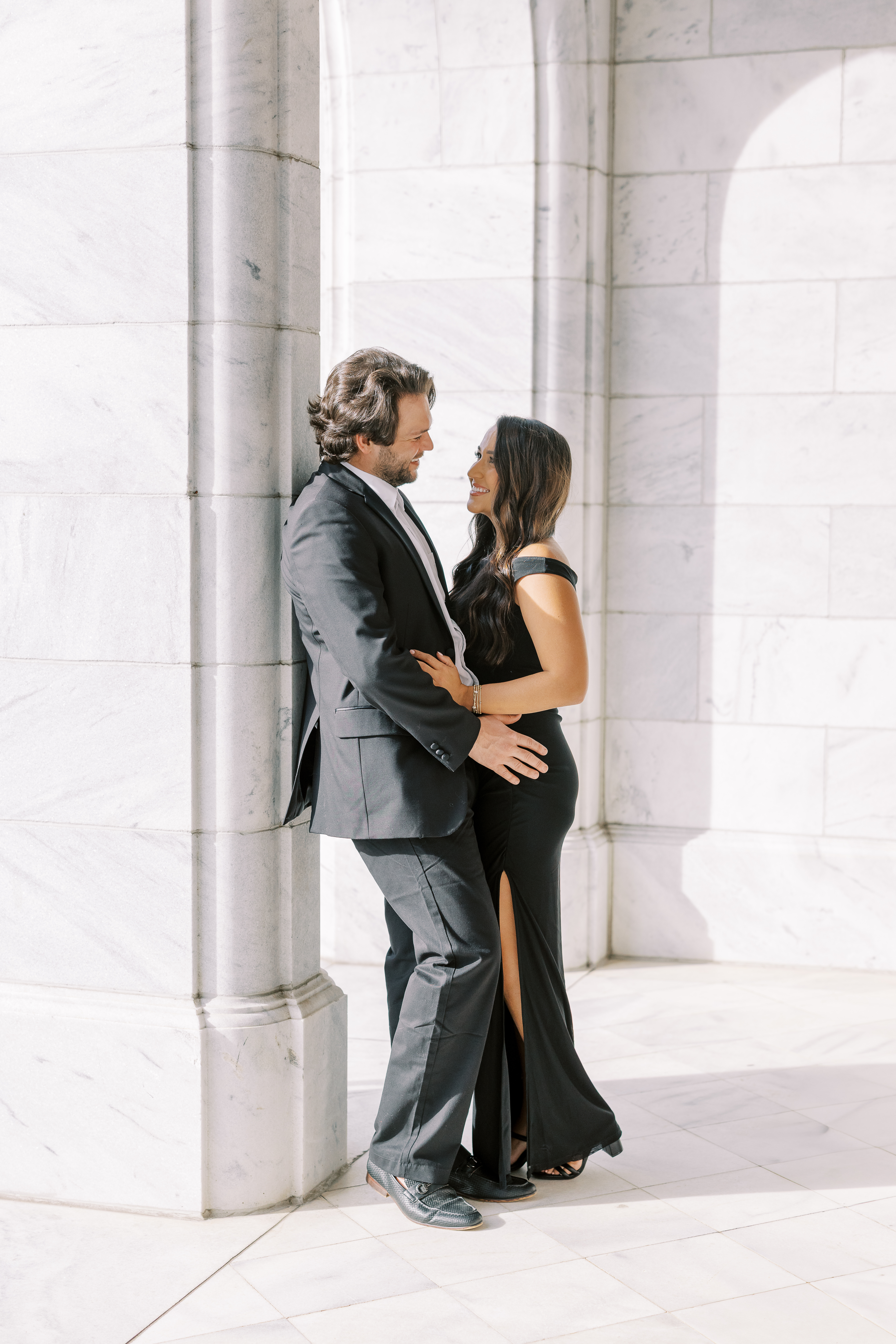 a couple having an engagement photoshoot in marietta square