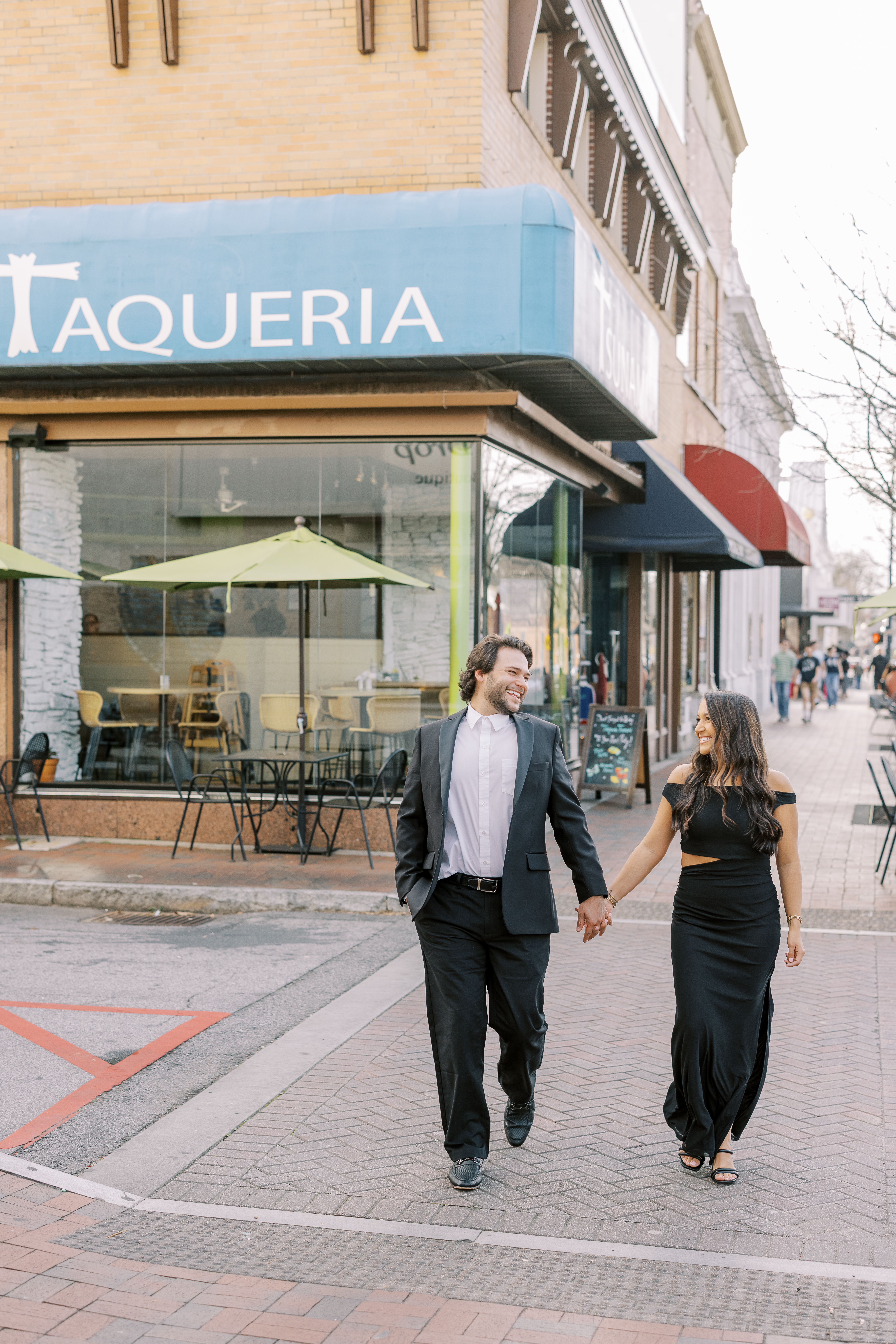 a couple having an engagement photoshoot in marietta square