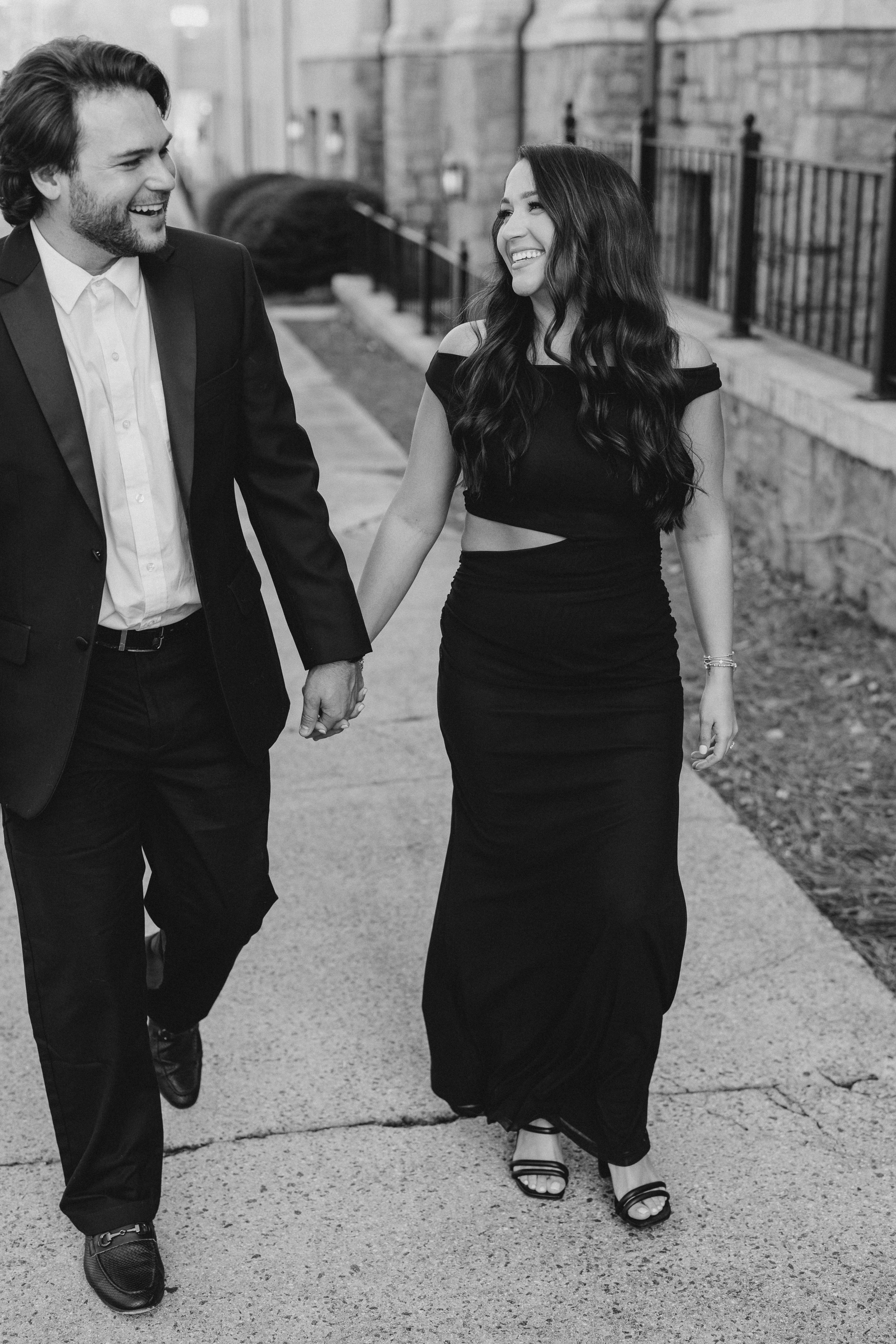 a couple having an engagement photoshoot in marietta square