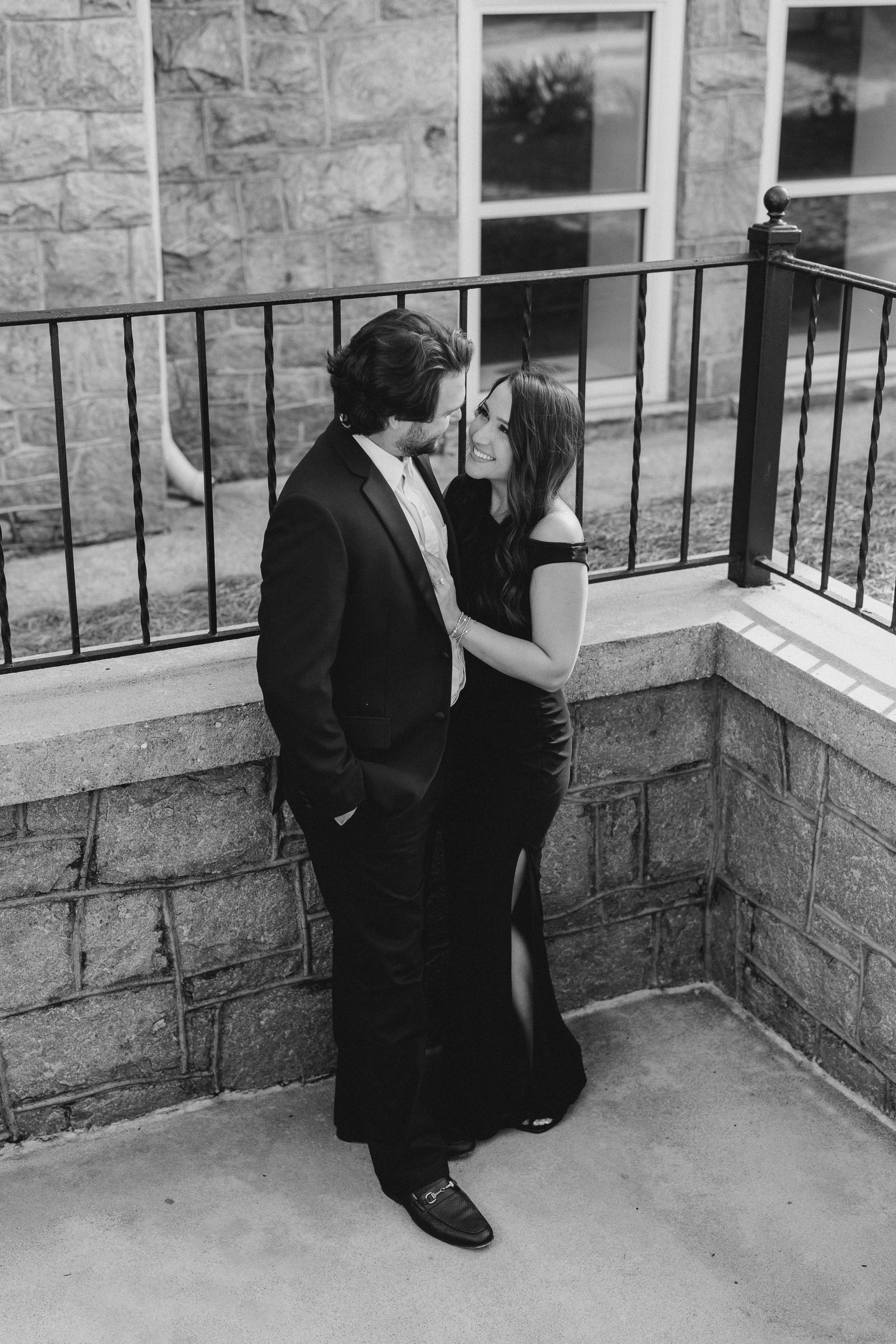 a couple having an engagement photoshoot in marietta square