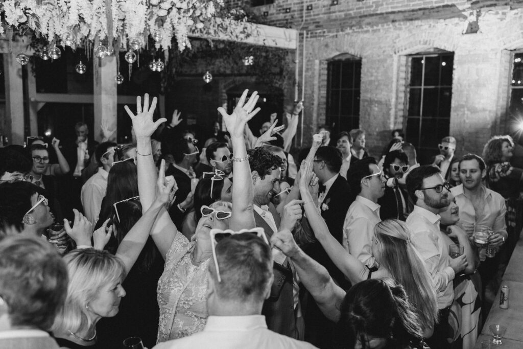A photo from a wedding reception held at Guardian Works in Atlanta, balancing elegance and industrial.
