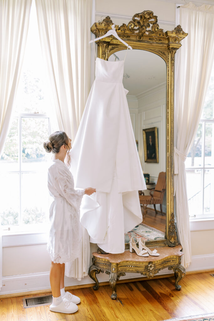 bride looking at her wedding dress