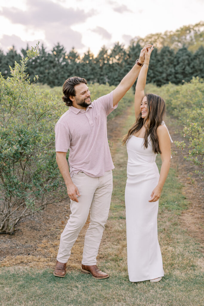 a couple in the blueberry fields at hadden estate