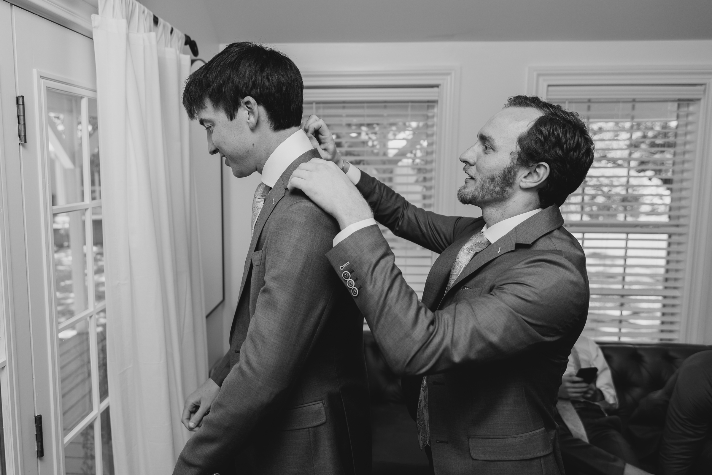groom and groomsman getting ready